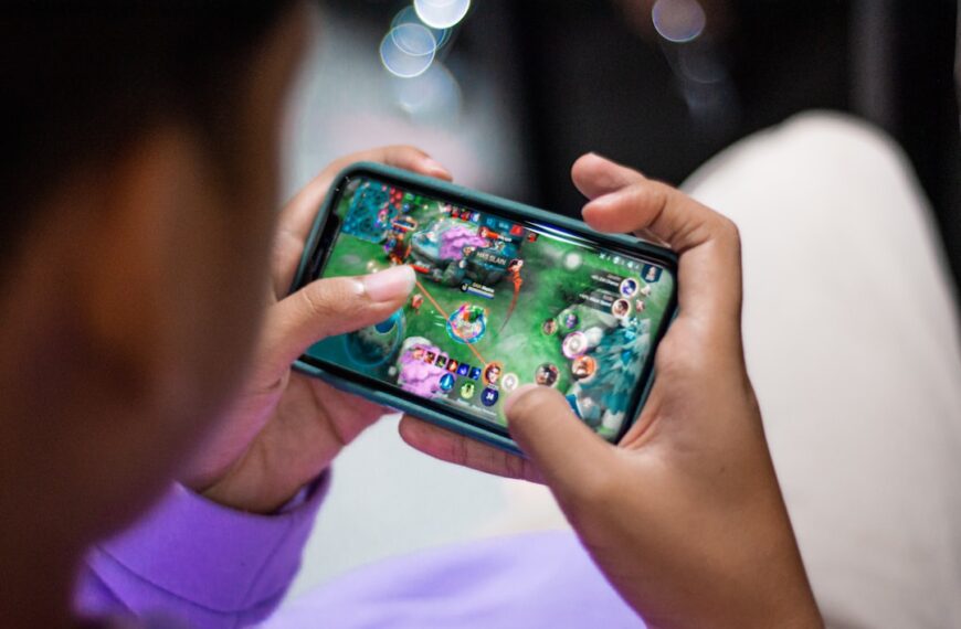 a person holding a cell phone in their hands